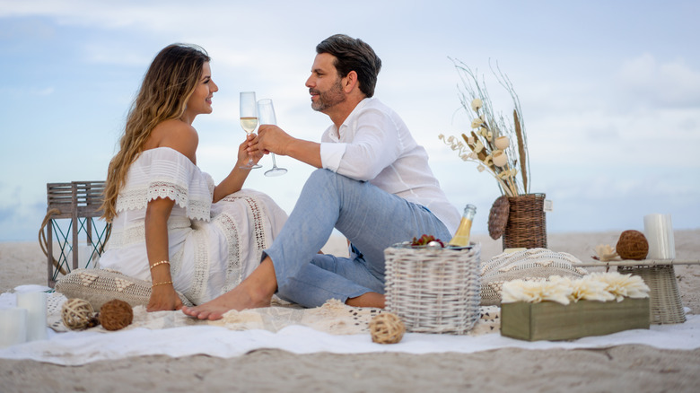 Couple having a romantic picnic on the beach