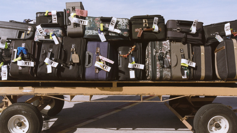 Piles of luggage on runway