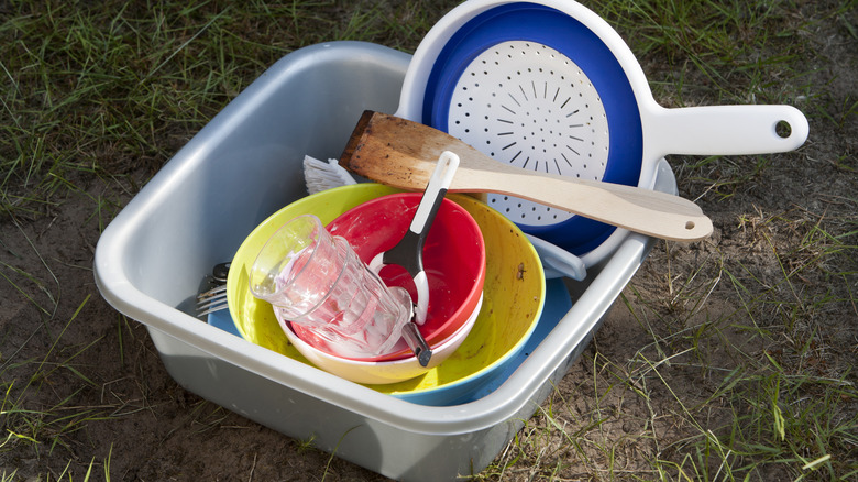 Pile of dirty dishes in washbowl