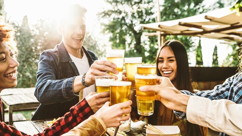 smiling people drinking beer