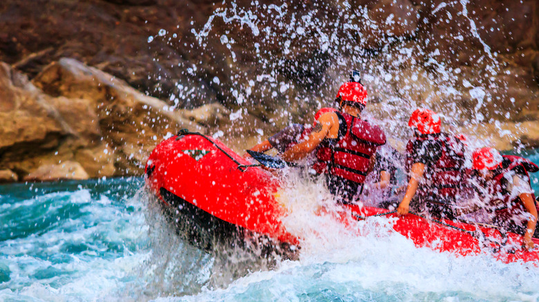 People white-water rafting