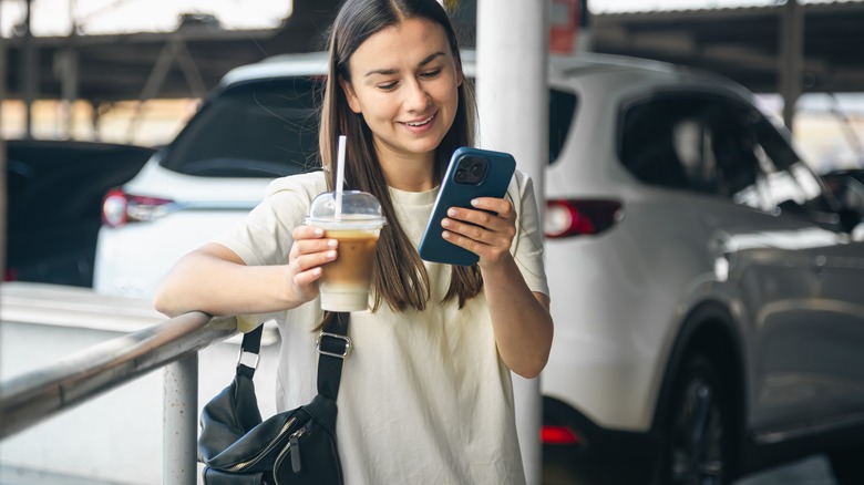 Traveler using their smartphone at the airport