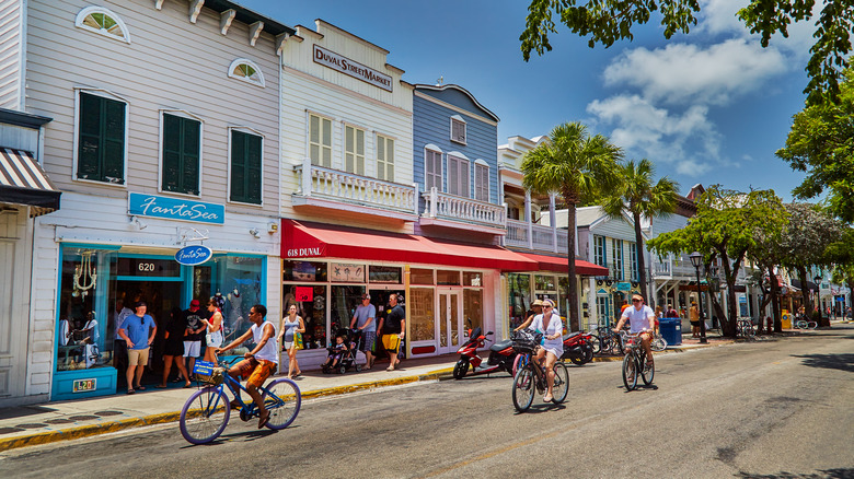 Cyclists pedal down Key West street