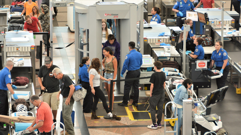 a busy airport security checkpoint