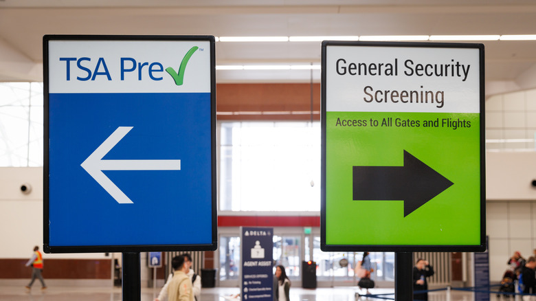 TSA PreCheck and regular security screening signs