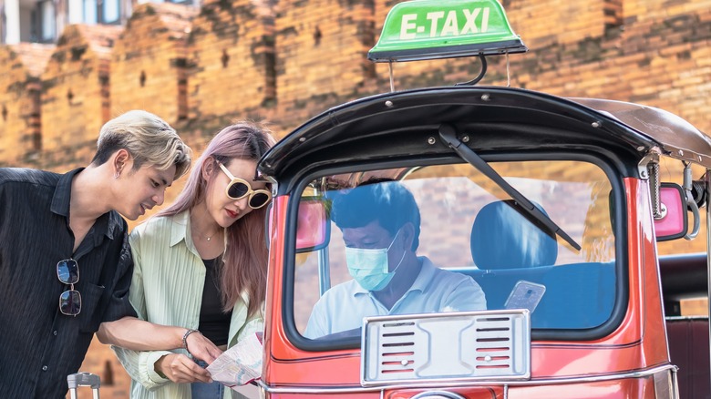 Couple with tuk tuk driver