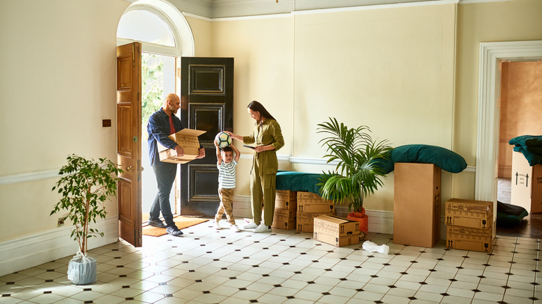 couple and child moving into home