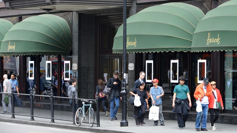 People walking past Harrods