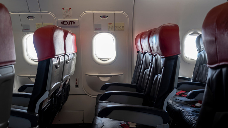 Emergency exit seats in aircraft cabin