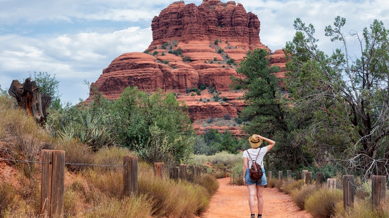 Woman walking towards Bell Rock