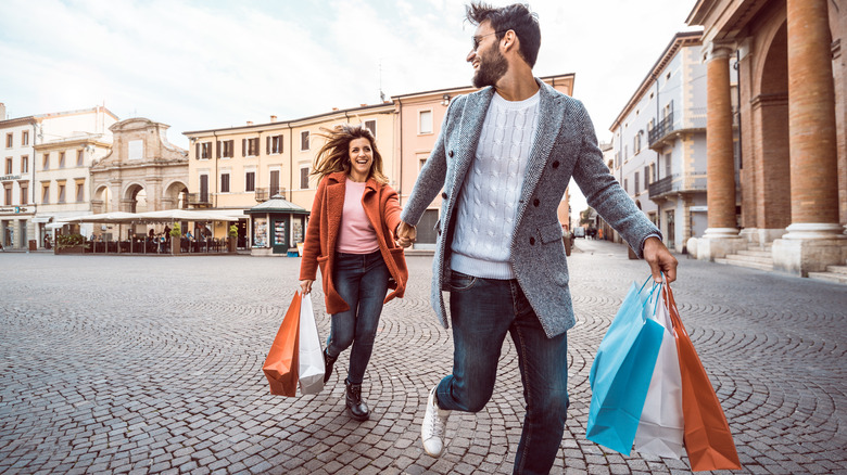 Tourists holding shopping bags 