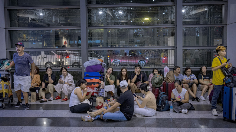 Passengers wait at airport