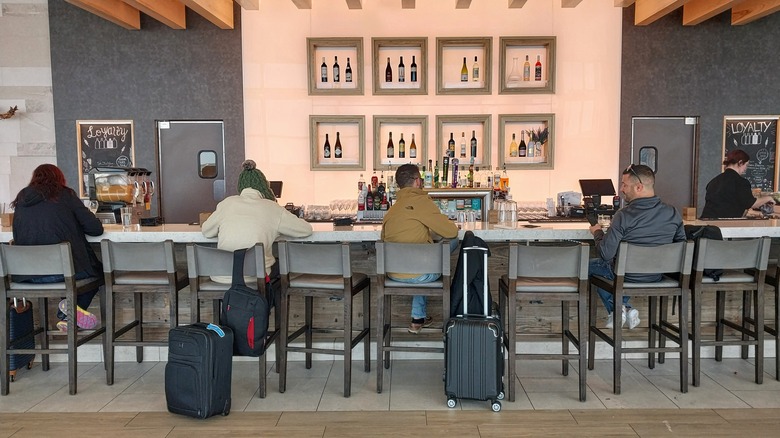 Travelers in an airport bar