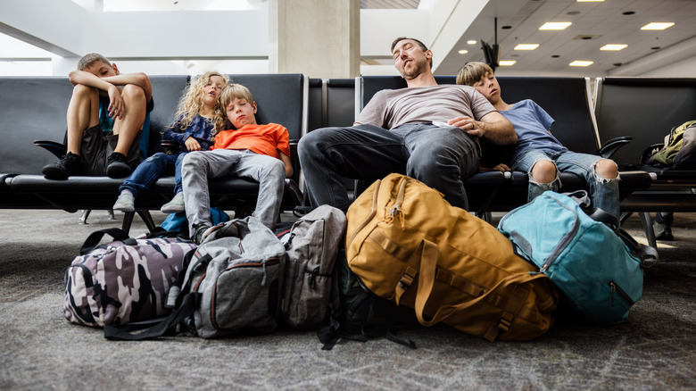 family with a ton of luggate in airport