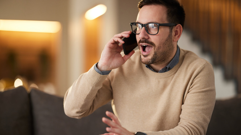 man talking loudly on phone