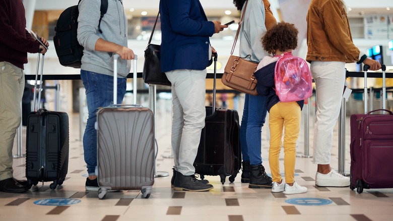 people in a line at airport