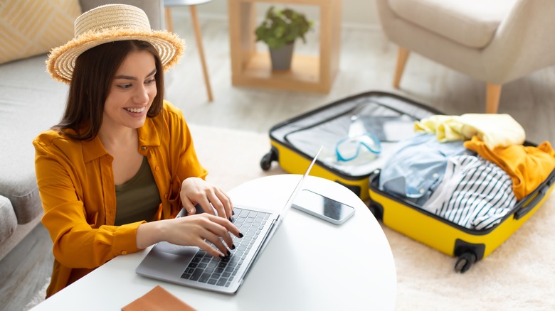 online shopping with open suitcase