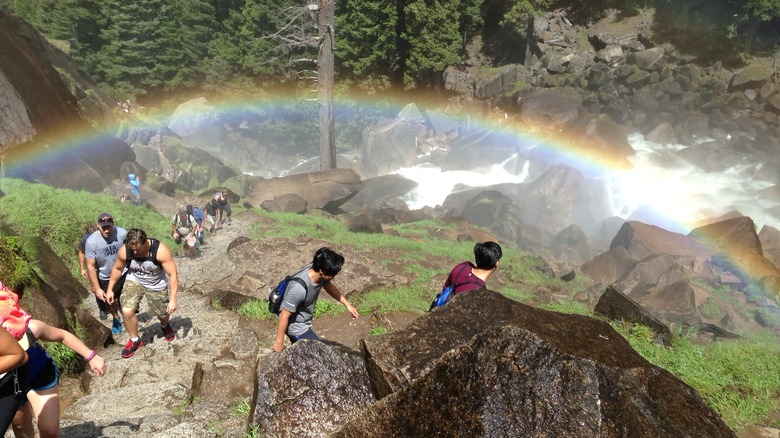 rainbow over hikers on mist trail
