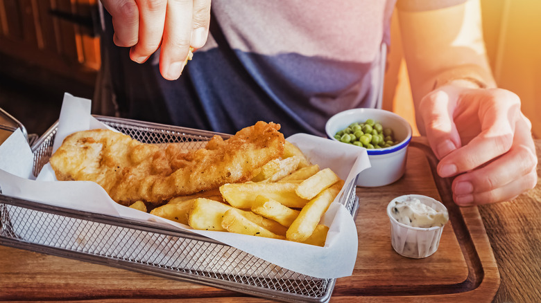 Man eating chippies