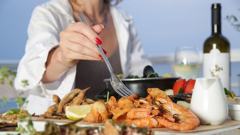 Woman enjoying a seafood platter