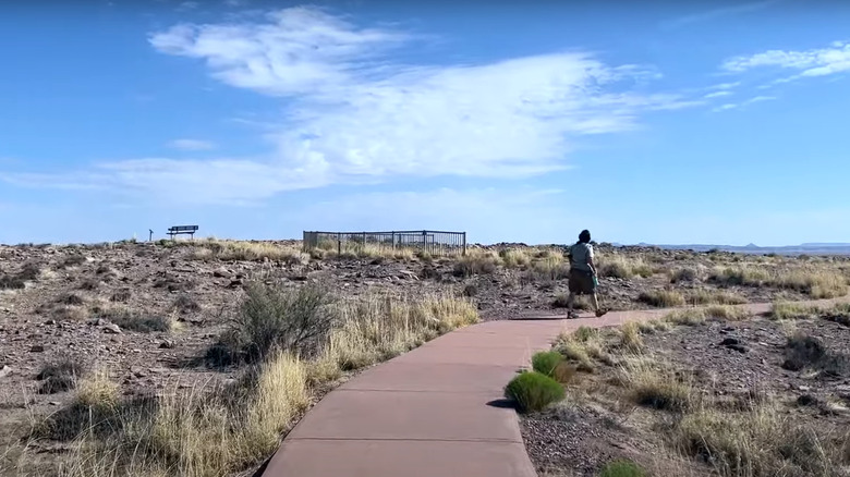 Visitor walking a park trail