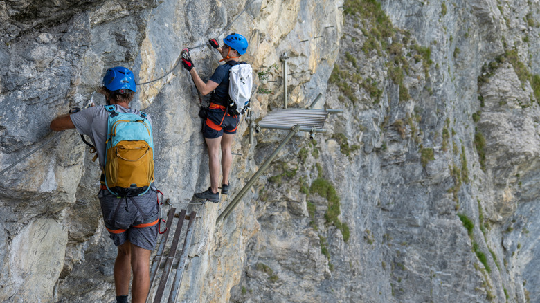 Two climbers on a via ferrata.