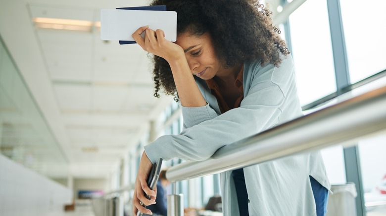 sad traveler at airport