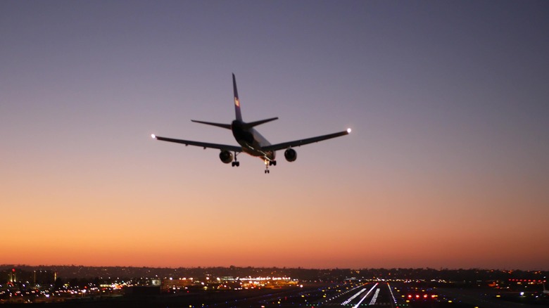 plane arriving at dusk