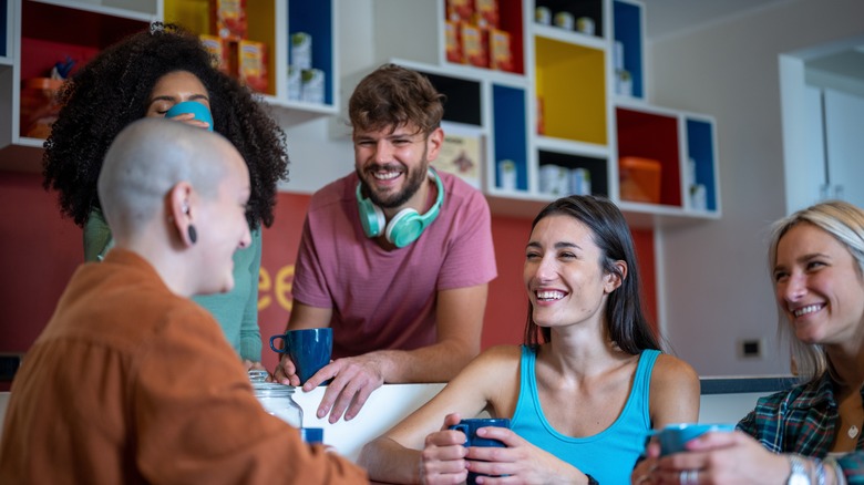 young hostel guests laughing together