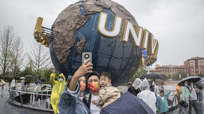 people in rain at Universal