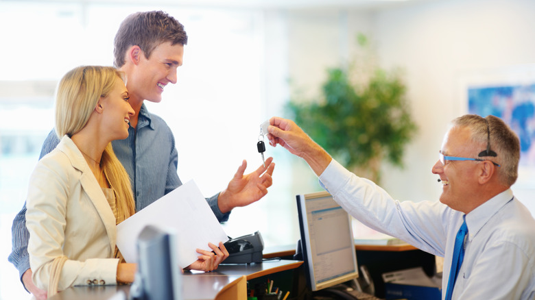 Couple at car rental desk