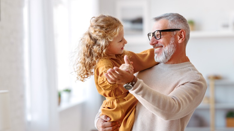 little girl dancing with grandpa