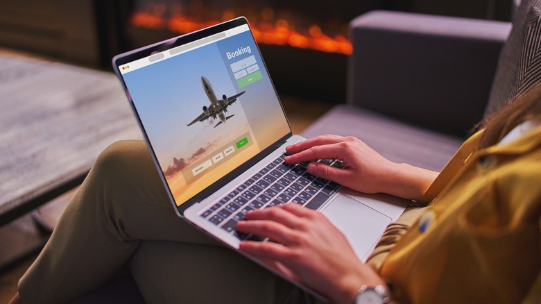 booking travel on a laptop