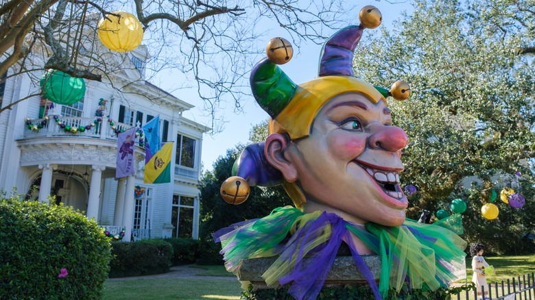 elaborate jester outside mansion