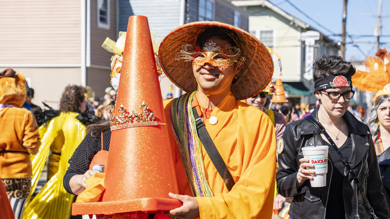 parade participant with traffic cone