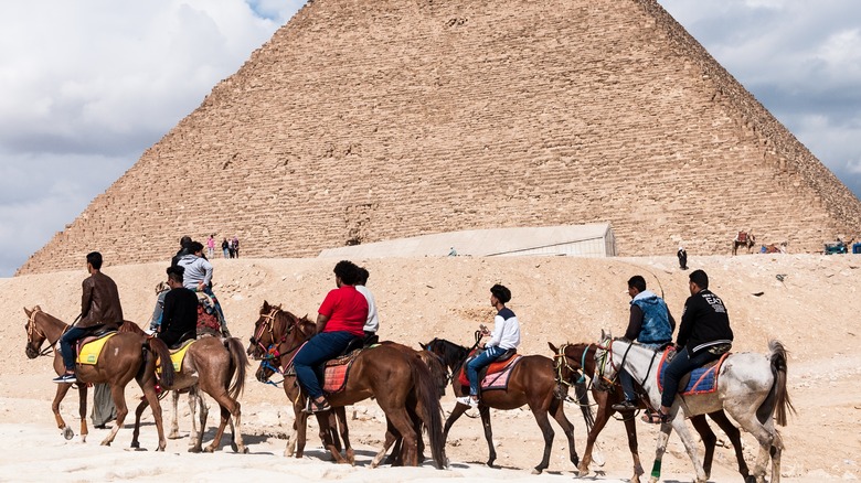Tourists on a tour at pyramids