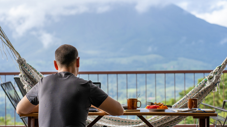 Man working with mountain view