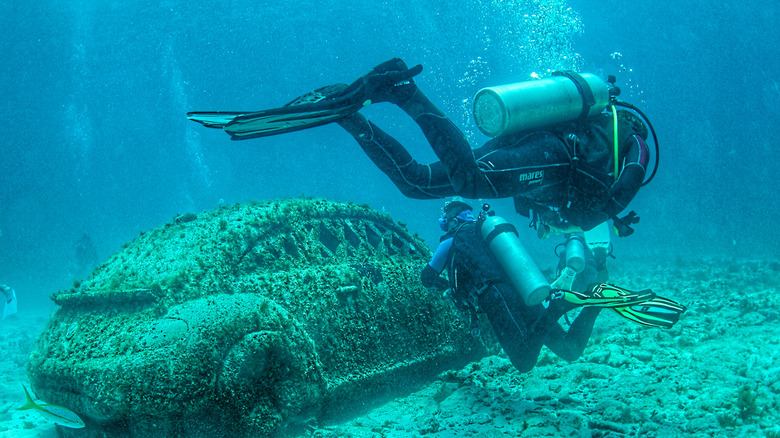 Divers at underwater sculpture